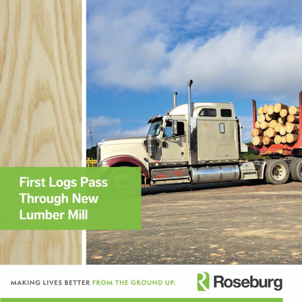 A log truck is hauling a full load of logs. A graphic overlay read, "First Logs Pass Through New Lumber Mill."