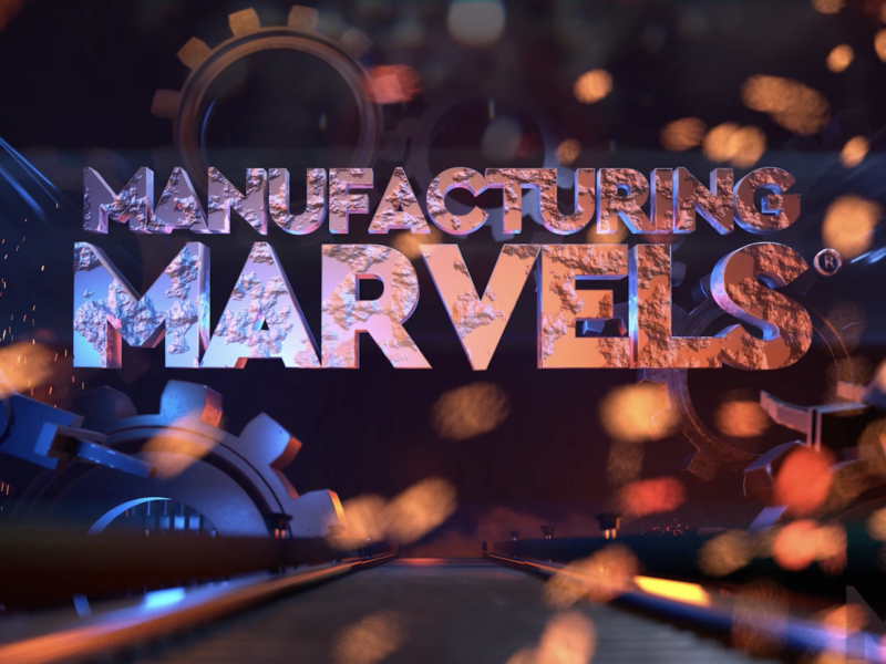 3D animated "Manufacturing Marvels" logo with sparks and machinery in the background